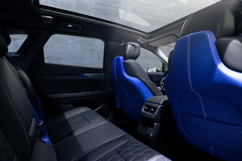 Back Seat View of the 2026 OPTIQ-V Blue Front Seats, Sun Roof, and Interior | Brotherton Cadillac in Renton WA