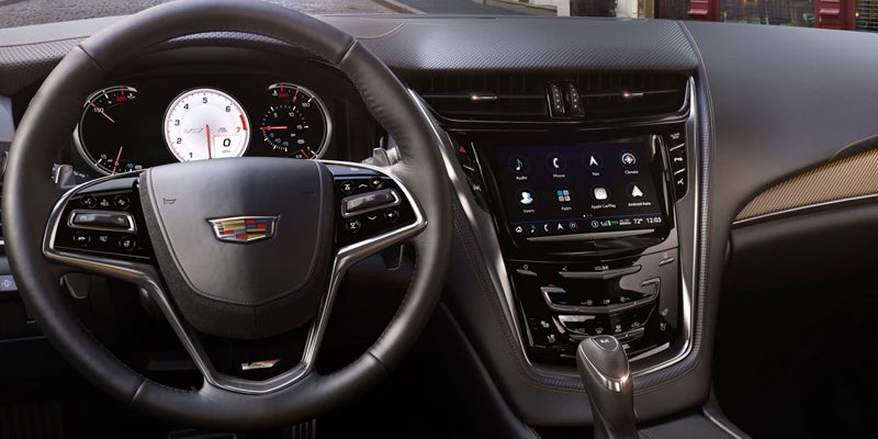 Interior view of 2019 Cadillac CTS steering wheel and navigation system